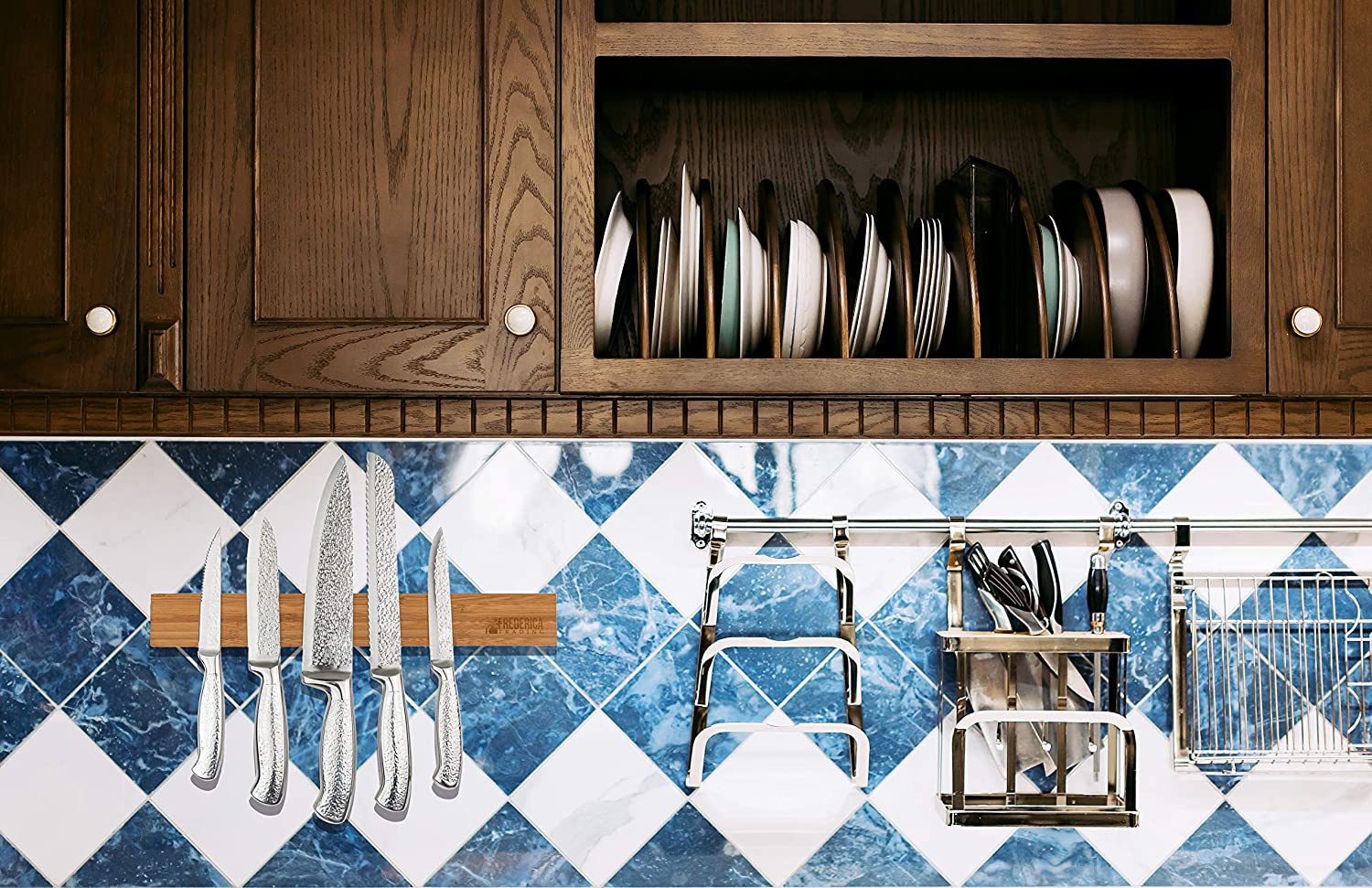 Wall mounted bamboo magnetic knife holder installed on a blue and white tiled kitchen backsplash below wooden cabinets.