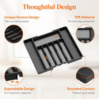 Product feature diagram of the black expandable silverware organizer highlighting its thoughtful design elements: a unique groove pattern for easy item retrieval, an anti-slip TPR material base, an expandable tray structure for maximum storage capacity, and smooth rounded corners.