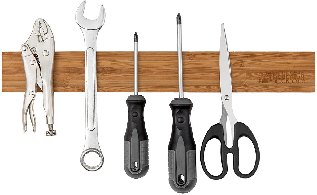 Wooden bamboo magnetic tool holder bar organizing garage hand tools including screwdrivers, wrenches, locking pliers, and scissors.